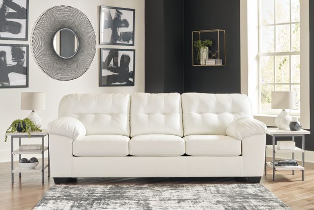 front view of a white leather sofa in a contemporary living room