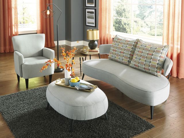 Front view of a modern living room with a curved sofa