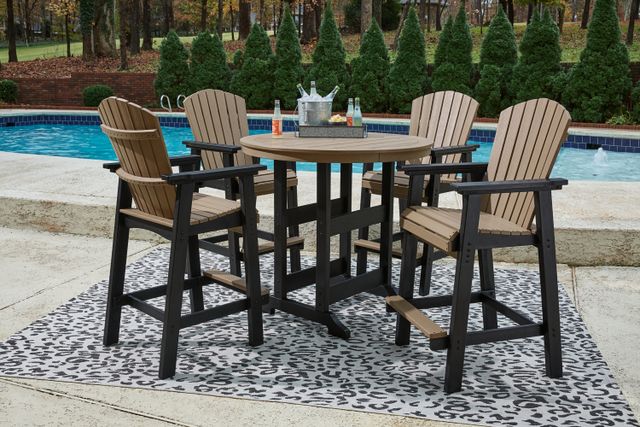 Front view of a plastic outdoor conversation set sitting poolside