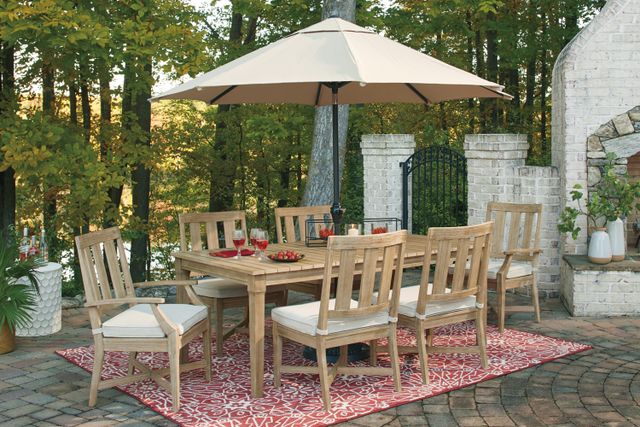 Front view of a modern outdoor patio with a rectangle table and chairs