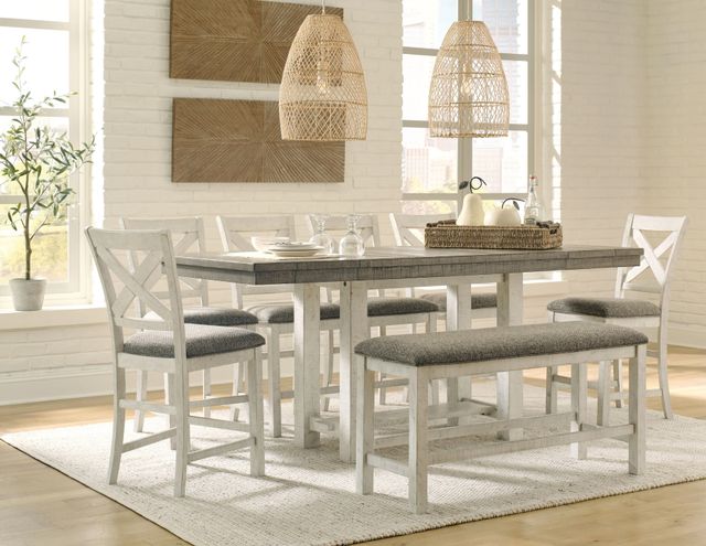 front view of a bright modern farmhouse dining room with a table chairs and bench