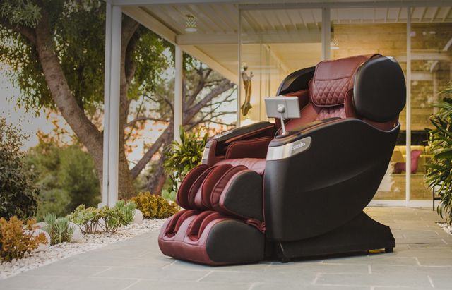 side view of a Cozzia massage chair in a modern ourdoor space