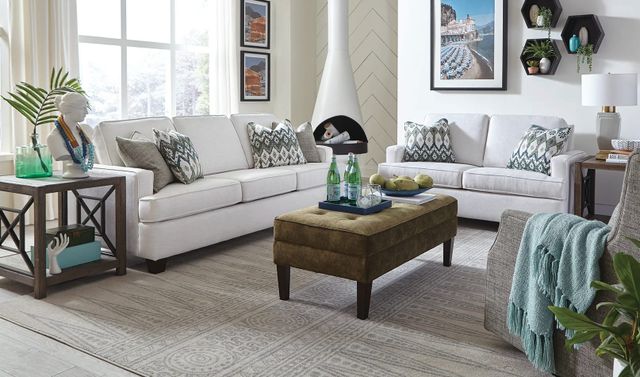 front view of a bright white modern living room with white england furniture 