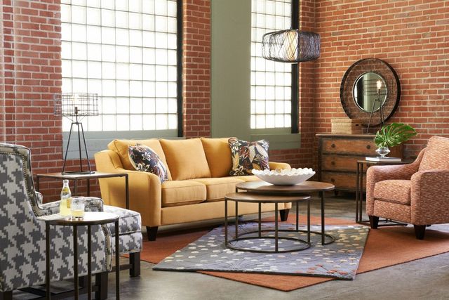 front view of a contemporary rustic living room with a contemporary yellow sofa