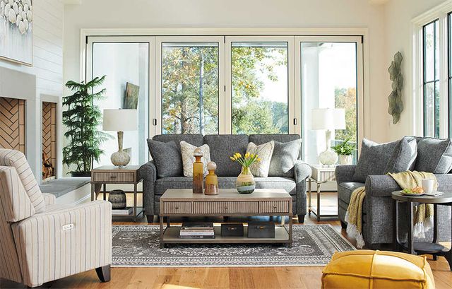 front view of a modern living room with a grey la-z-boy sofa