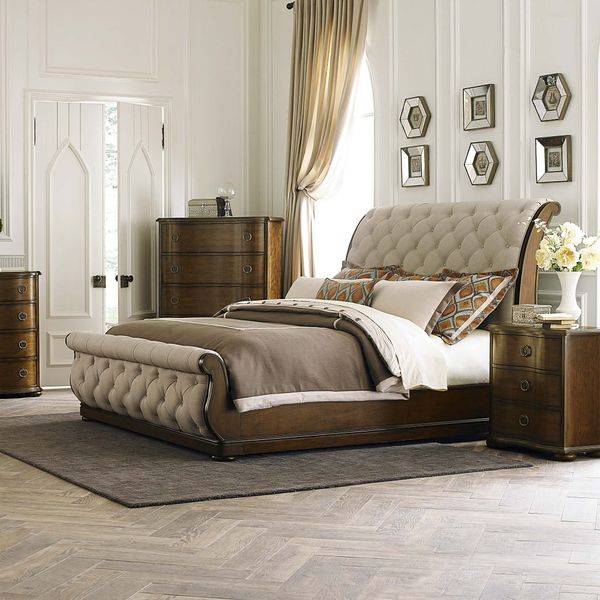 Upholstered sleigh bed in an upscale bedroom