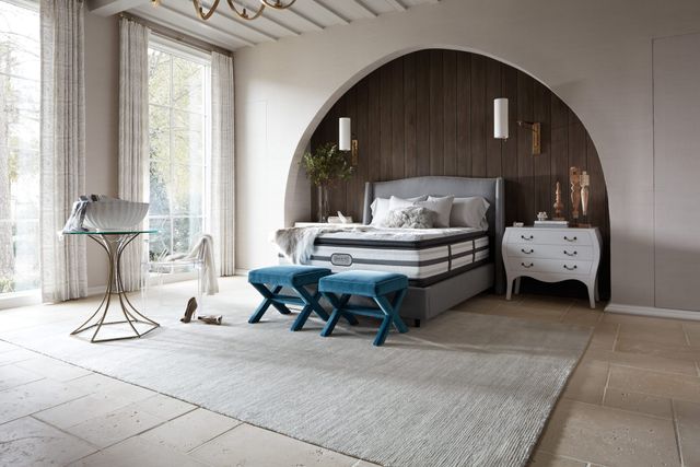 Front view of a luxury bedroom with a full size Beautyrest bed and mattress