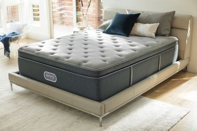 Front view of a modern bedroom with a Beautyrest level two mattress