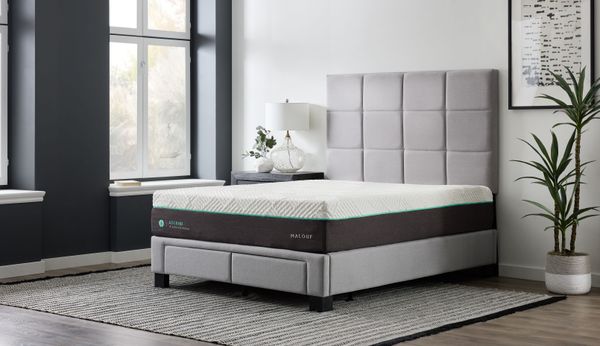 front view of a modern bedroom with a malouf mattress on a grey bed frame