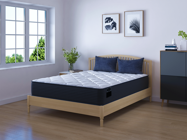 front view of a modern bedroom with a Scott Living by Restonic mattress