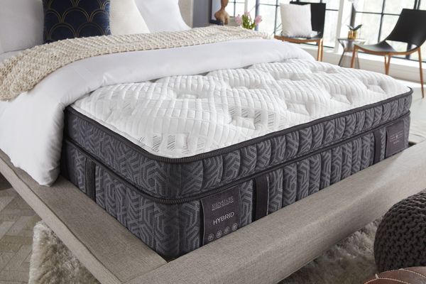 The pillowtop surface of a plush Restonic mattress
