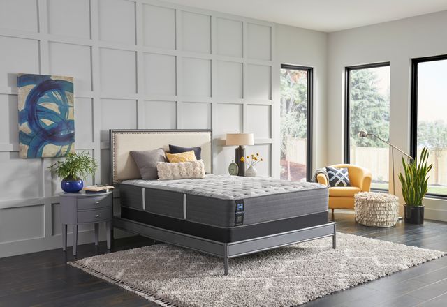 View of a modern bedroom with a Sealy soft mattress