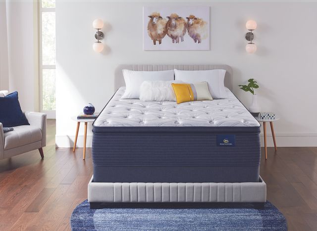front view of a Serta mattress in a casual bedroom