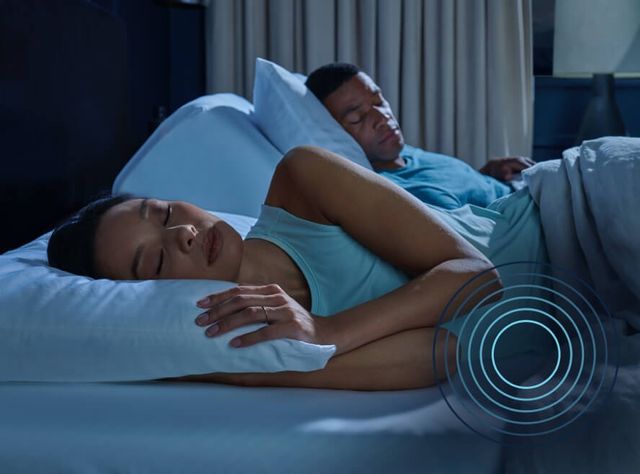 view of a woman laying on her side with circles animated to show common pressure point spots that Tempur-Pedic targets