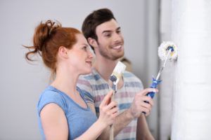 couple painting a room