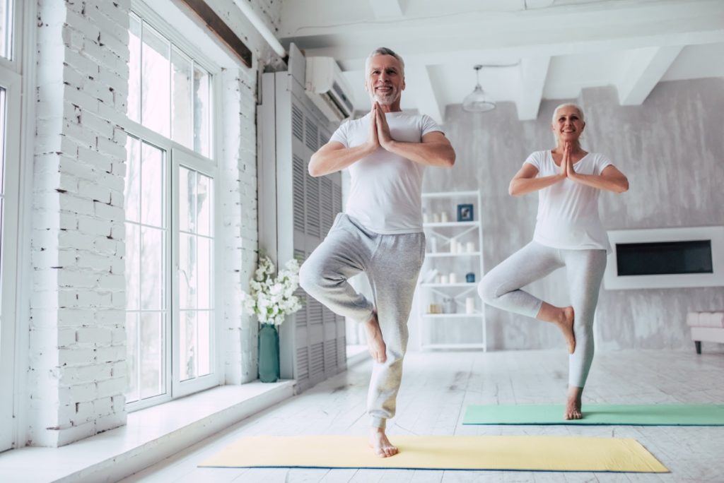 Older man doing yoga