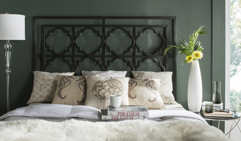 A Queen sized, Gun metal colored, metal headboard with a Quarterfoil design.