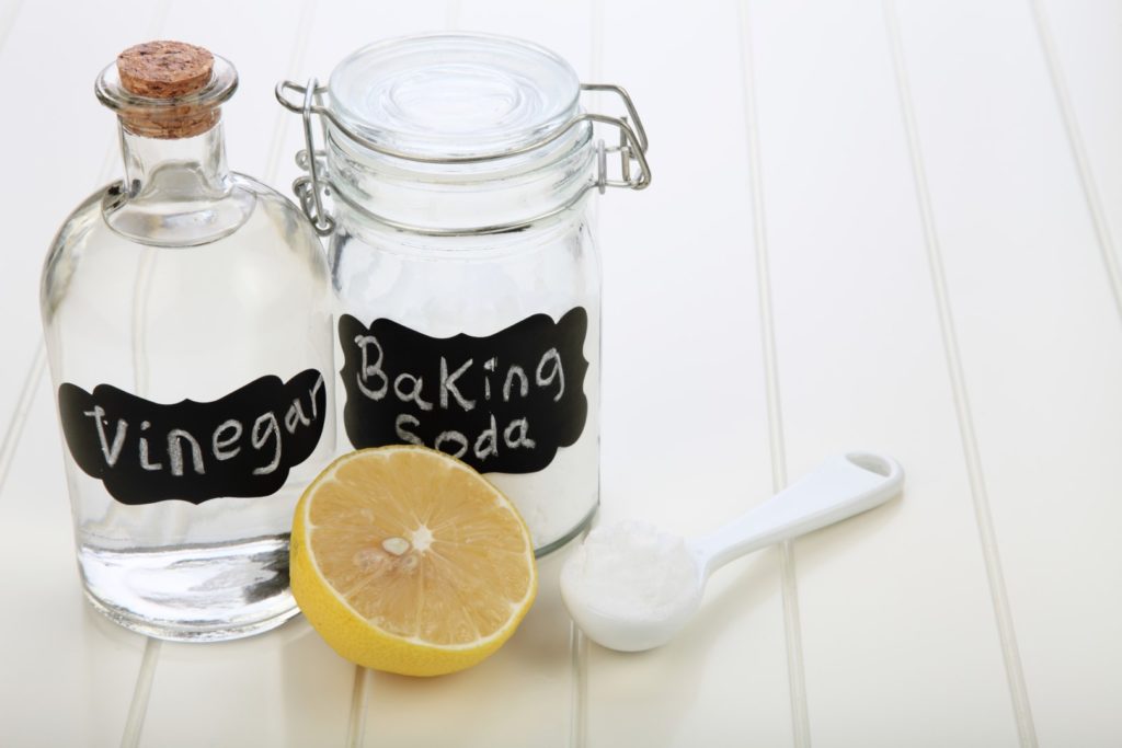 cleaning a microwave with lemon, baking soda and vinegar