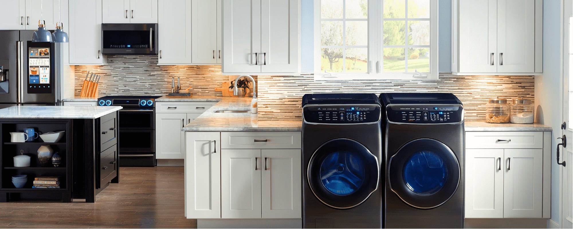 wide shot of kitchen and laundry are equipped with Samsung appliances