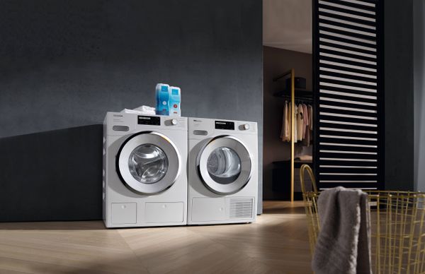 Laundry Room Showcasing a Miele T1 4.0 Cu. Ft. White Edition Lotus White Heat-Pump Tumble Dryer