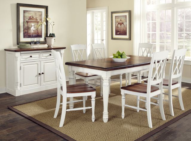 view of a modern transitional dining room with a white and dark wood dining table set for 6