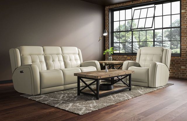 front view of a rustic style living room with a cream leather sofa and matching chair