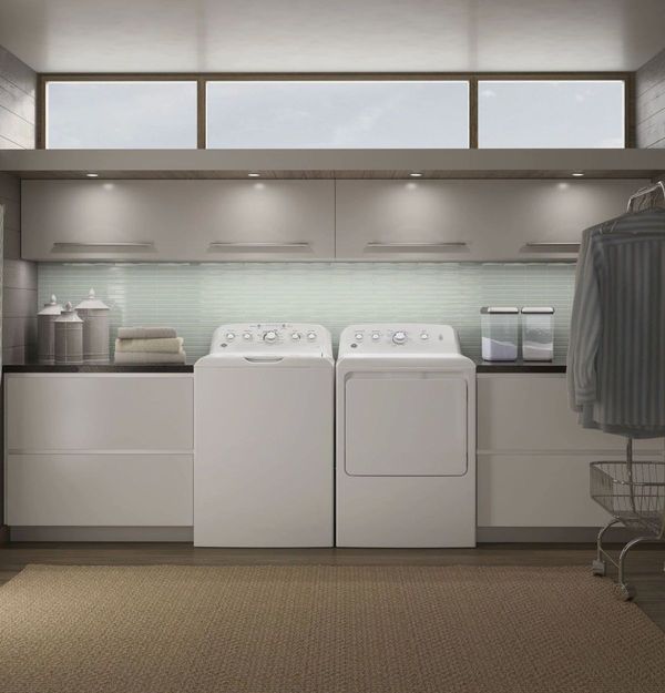 Laundry room featuring a GE White Laundry Pair