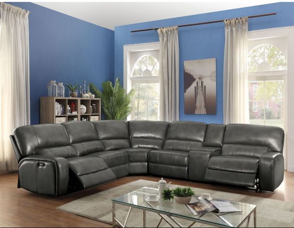 Living room featuring an ACME Furniture Saul 3-Piece Gray Power Motion Sectional