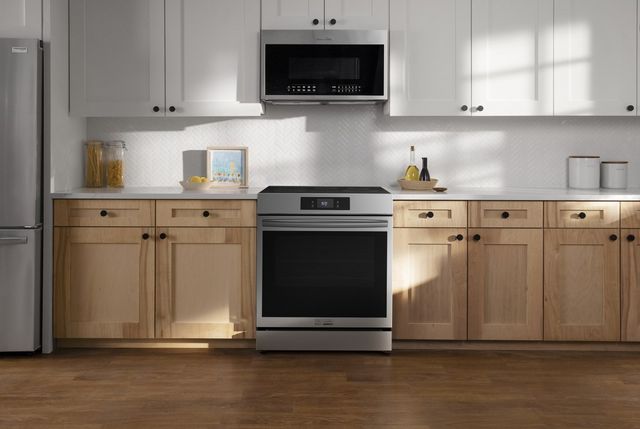 electric stove in white kitchen with white cabinets