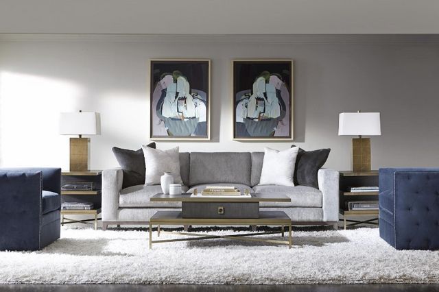 unique-gray-sofas front view of a gray sofa in casual contemporary space with a navy accent chair and glass and gold accent tables