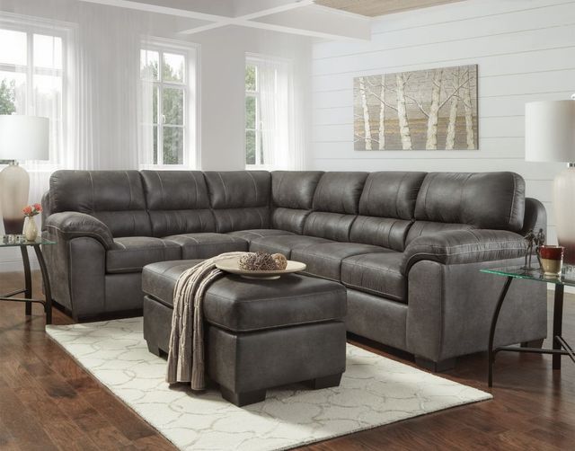front view of a dark brown leather sectional in a modern farmhouse living room