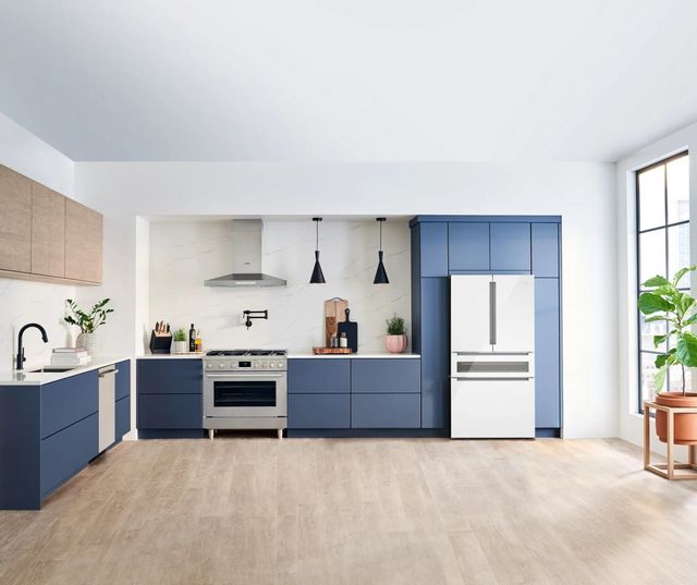 front view of a modern kitchen with a smart fridge built into the cabients