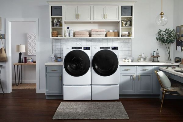 Laundry room showcasing Whirlpool 4.5 Cu. Ft. White Front Load Washer and Dryer