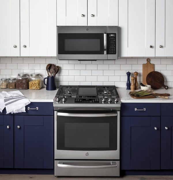 Kitchen Showcasing GE Series 1.9 Cu. Ft. Stainless Steel Over the Range Microwave and Range
