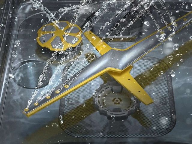 The Samsung wash system at work within the stainless steel tub of a dishwasher