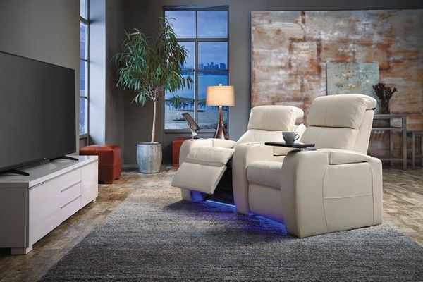 side view of white theater seating in a modern home theater