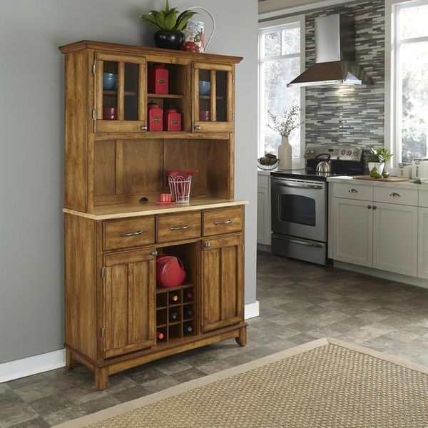front view of a wooden dining hutch in a modern kitchen