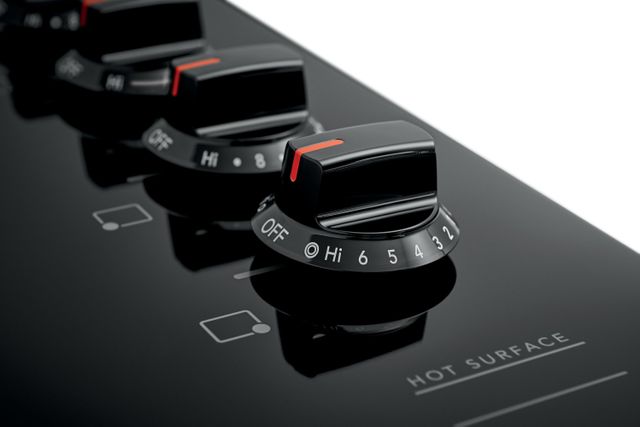 closeup view of cooktop knobs