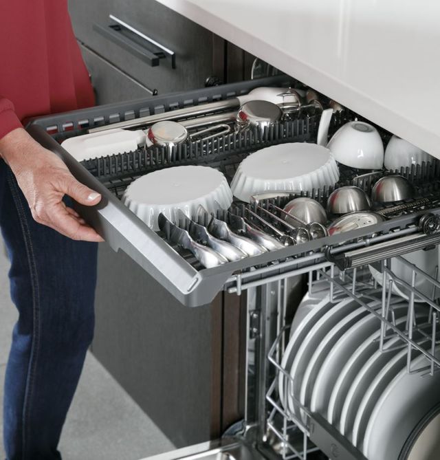 A hand pulls out the third rack of her GE Profile dishwasher