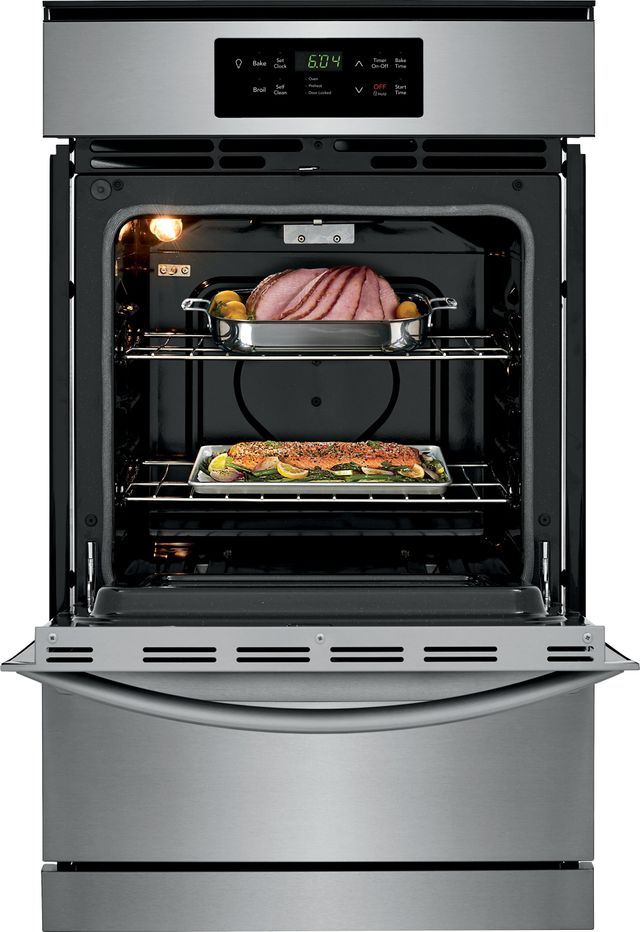 Open oven with two dishes baking