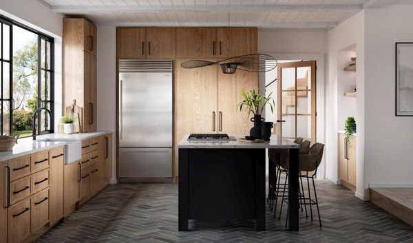 Kitchen Showcasing a Sub-Zero Classic Series 20.7 Cu. Ft. Stainless Steel Built In Bottom Freezer Refrigerator