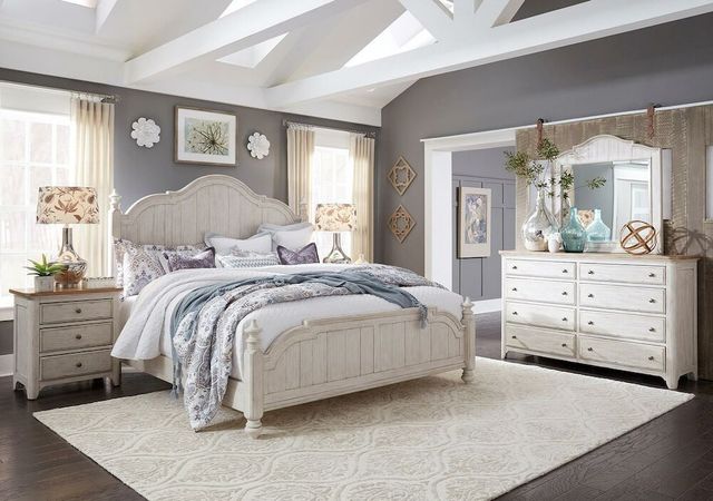 front view of a modern farmhouse bedroom with a white farmhouse matching bedroom set