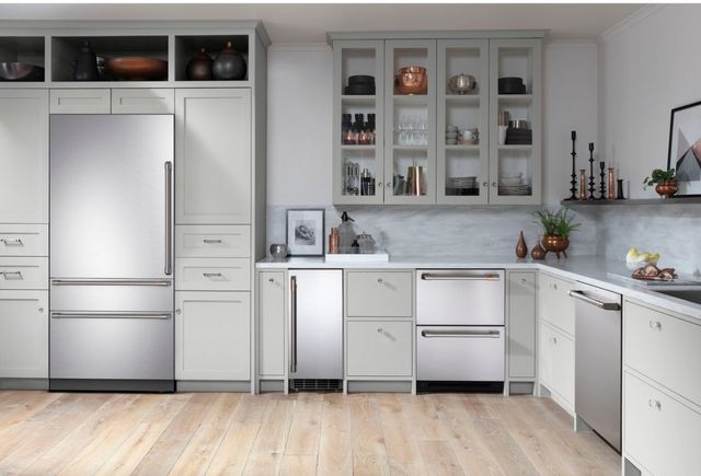 Stainless steel appliances are featured in a modern kitchen