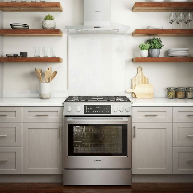 Bosch dual fuel range in a kitchen with light grey cabinets