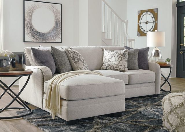 front view of a modern living room with a light grey chaise sofa