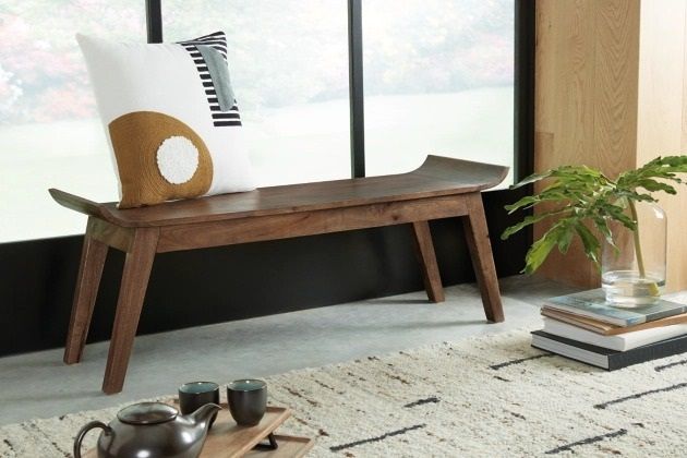 front view of a wooden accent bench with an accent pillow