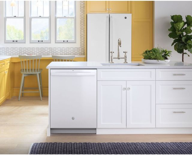 GE built in dishwasher in yellow and white kitchen