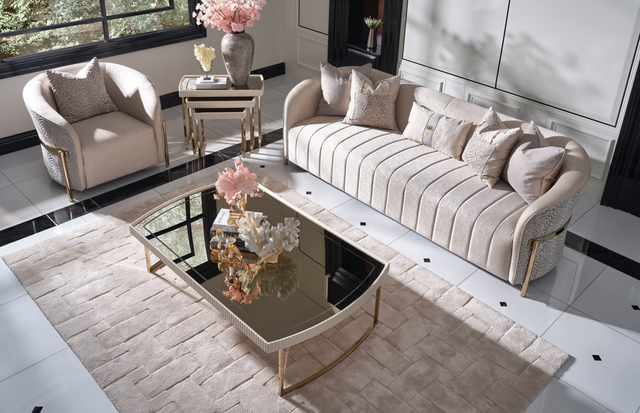 top front view of a glam formal living room with light pink furniture and white walls