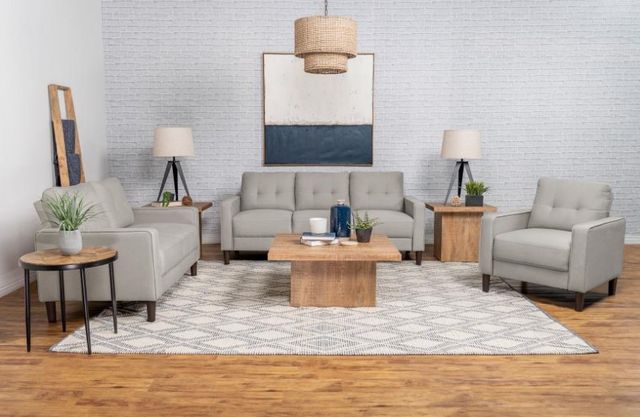 front view of a modern living room with a matching sofa, loveseat, and chair
