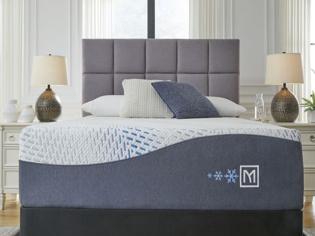 front view of a sierra sleep gel memory foam mattress on a modern grey upholstered bed frame
